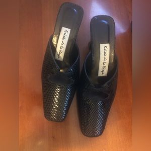 Autographed Krista de la Harpe leather black square toed kitten heel mules.
